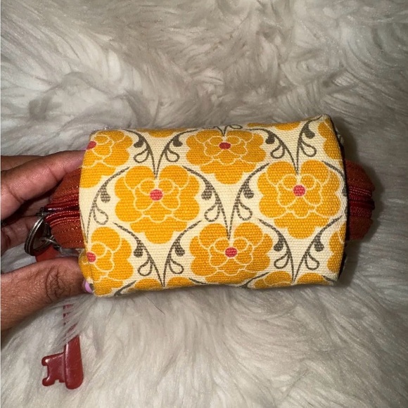 Fossil canvas cosmetic pouch featuring a floral pattern and a signature key fob - Picture 5 of 7